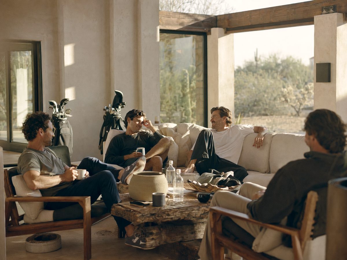 Bachelor party group in a modern living room during a mobile IV visit